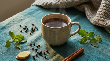 Warm Ayurvedic kadha with ginger, tulsi and spices